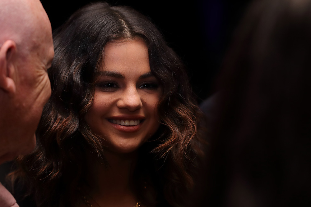 Signer and actress Selena Gomez speaks at a mic
