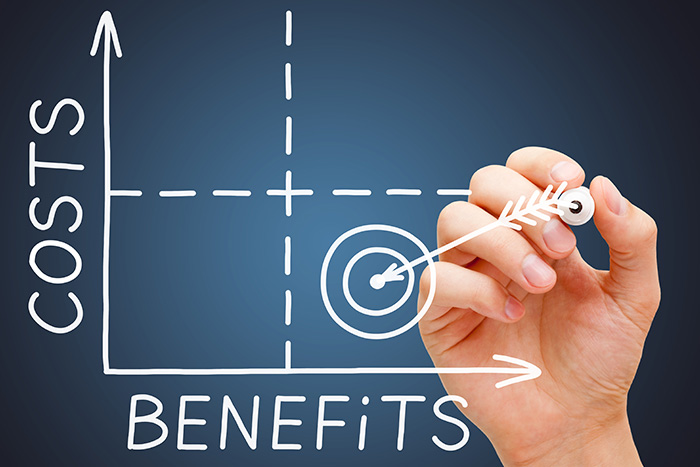 Image of hand drawing graph of cost vs. benefit