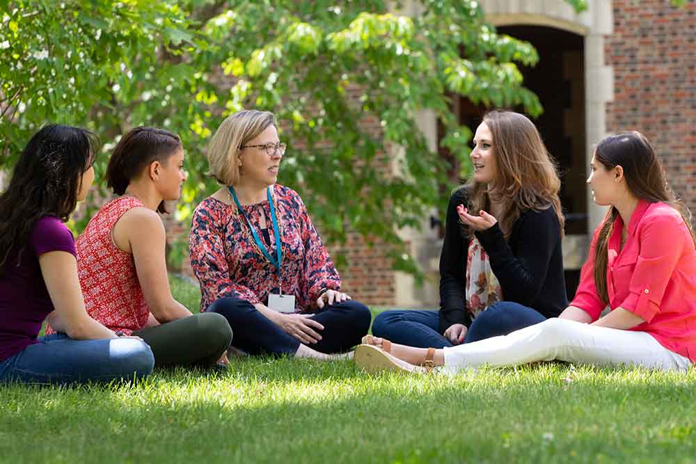 Young women with staff member