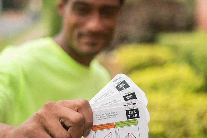 Young man displays cards