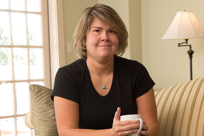 Woman sitting with coffee cup