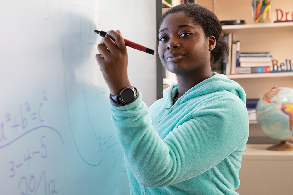 Student at the Arlington School uses a smartboard