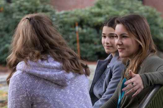 Clinician speaks with teens outside