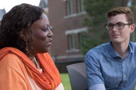 Woman talks in group therapy outside