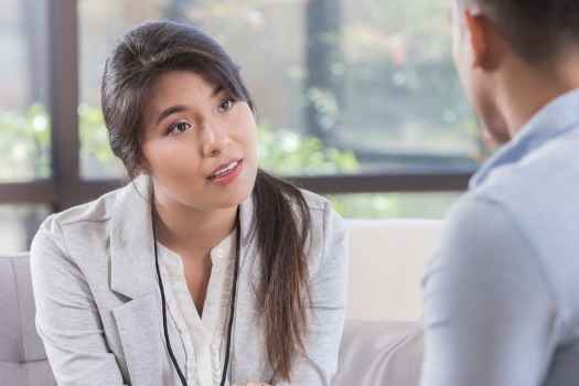 Clinician talks with patient