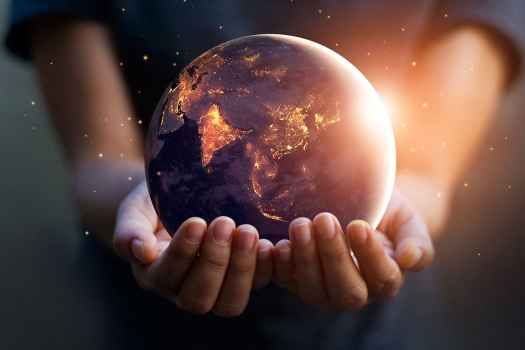 Hands hold globe