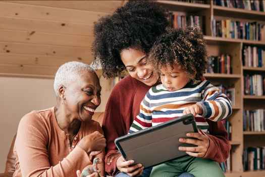 family looking at tablet together