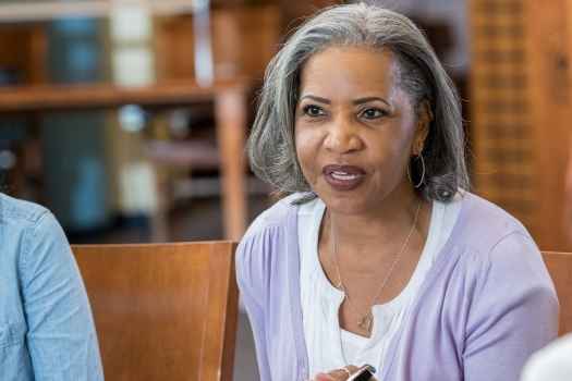 Woman leads a group therapy session
