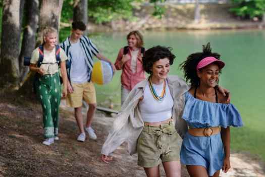 Group of teens walking near a lake
