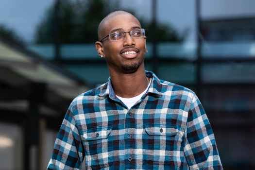 Deconstructing Stigma participant Charles - person in plaid shirt outside