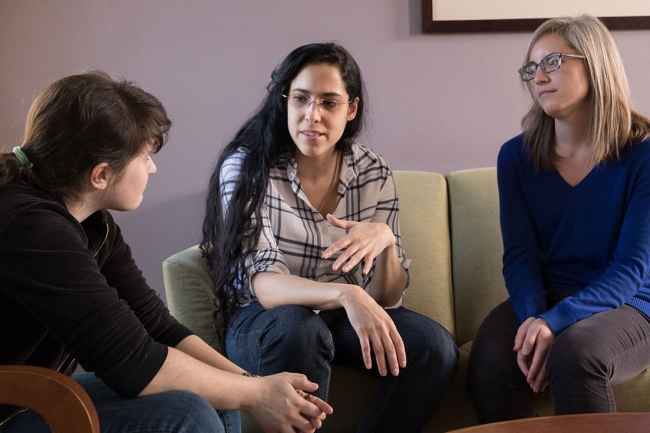 Young women talk in therapy at 3East DBT program for teens and young adults