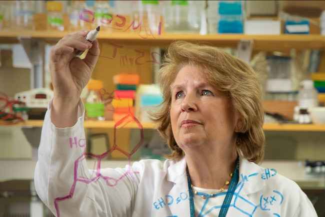 Dr. Bertha Madras works in a lab