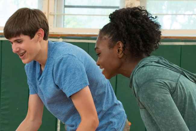 Two teens laughing and playing