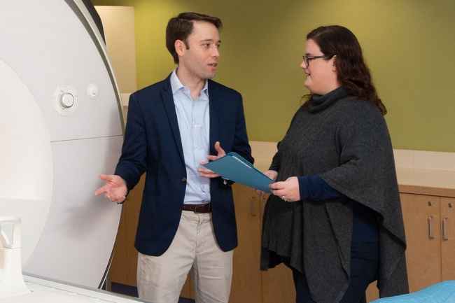 Researchers talk by MRI