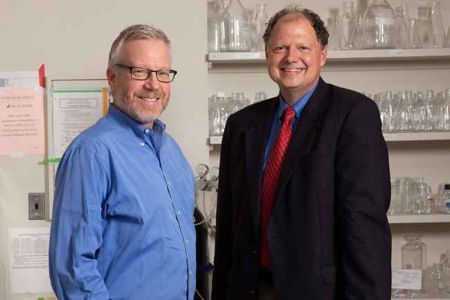 Drs. Bill Carlezon and Kerry Ressler in a science lab
