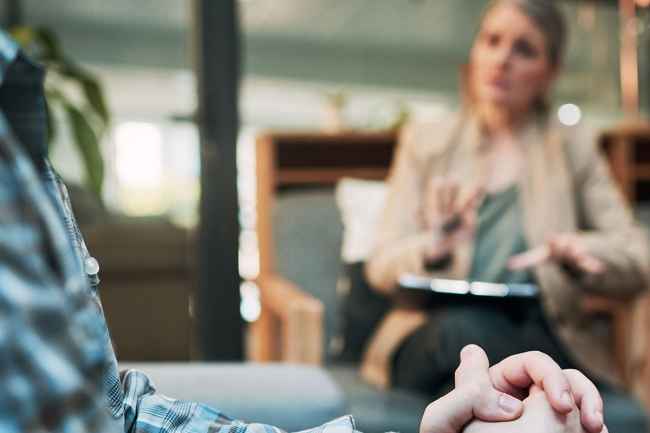 Patient talks to therapist