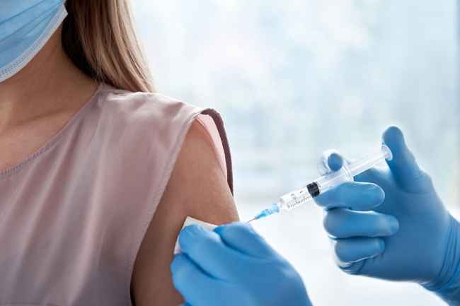 Woman receives vaccine