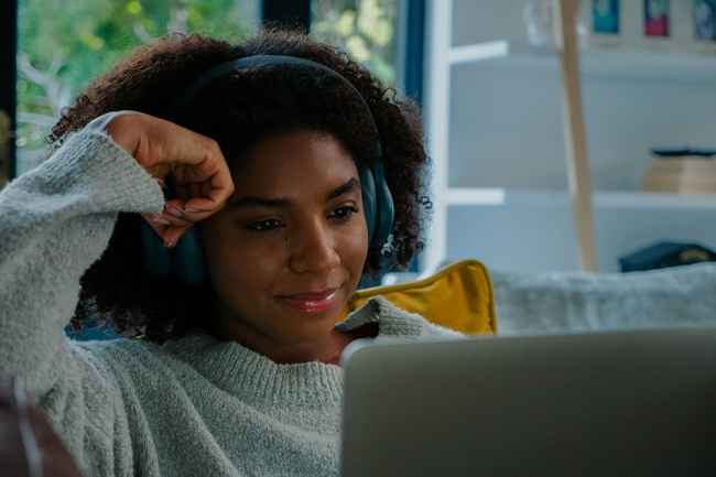 Young woman watching laptop