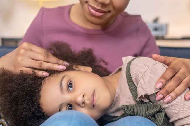 Child lying on lap