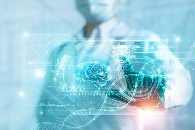 Medical professional in scrubs using a futuristic touch screen that shows an image of a brain