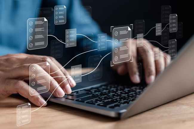 Person reviewing digital documents on a laptop