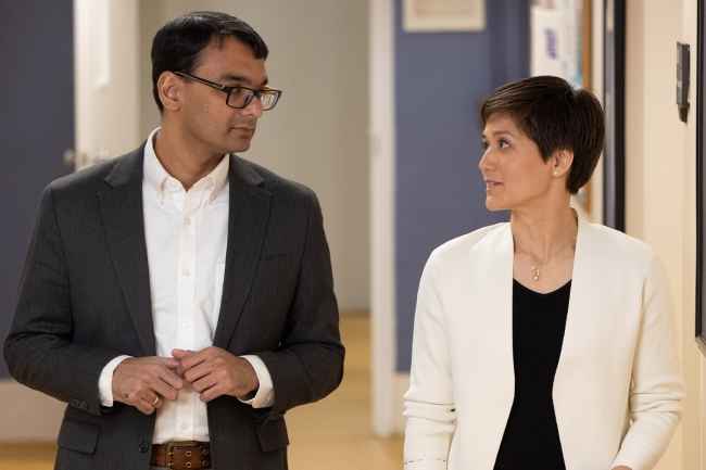Two people walking and talking
