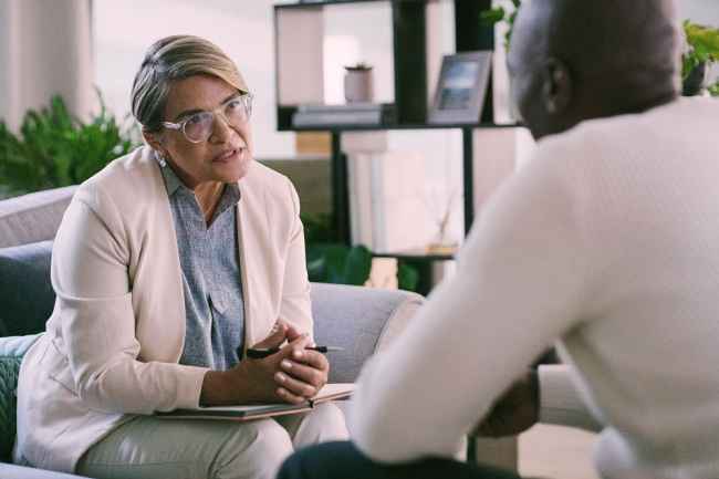 Female therapist speaking with a patient