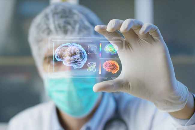 Scientist holding a futuristic brain scan display