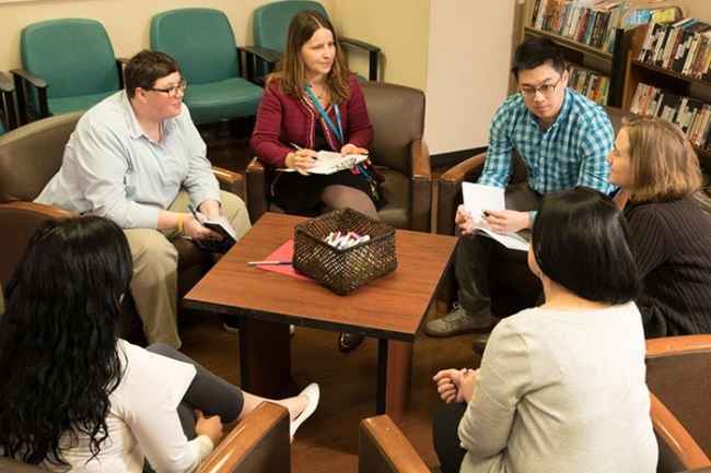 Group having a discussion in chairs