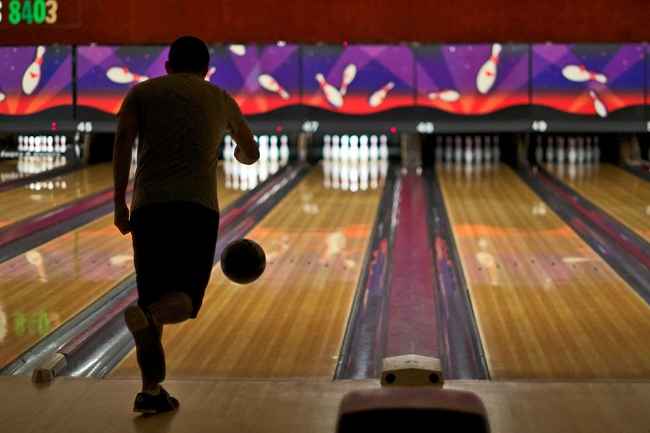 Person bowling at bowling lanes