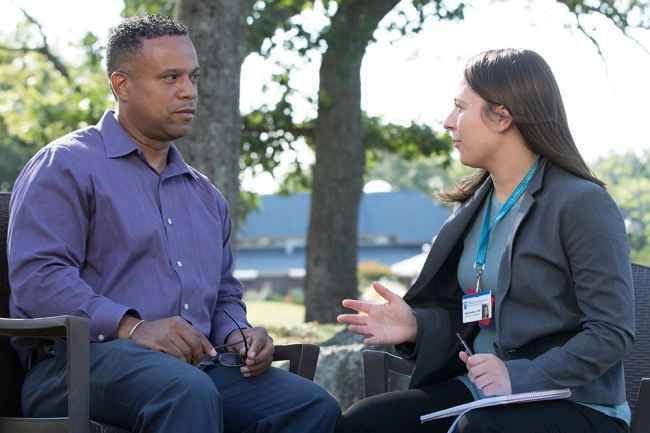 Patient and clinician talk outside