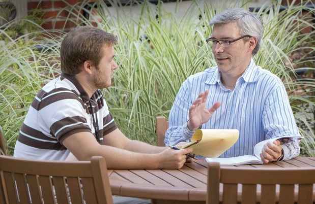 Patient and clinician talk outside
