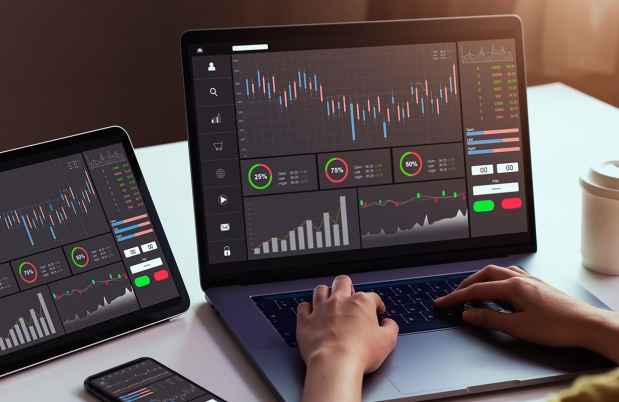 Woman on computer looking at graphs and data