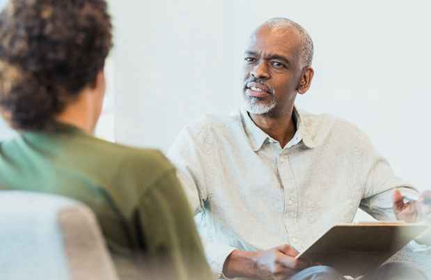 Clinician talks to patient
