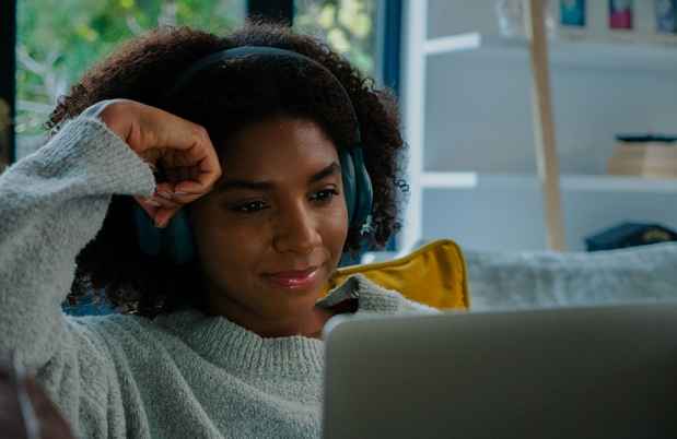 Young woman watching laptop