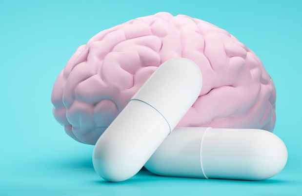 graphic of a brain and 2 pills in front of it
