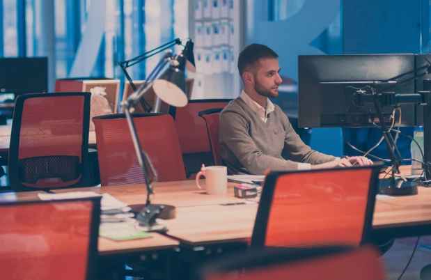 man working alone in an office space
