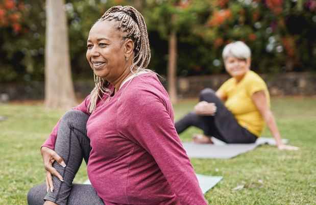 Women doing yoga outside