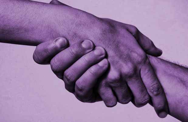 Purple graphic of a hand reaching and grabbing another