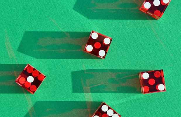 red dice on a green background