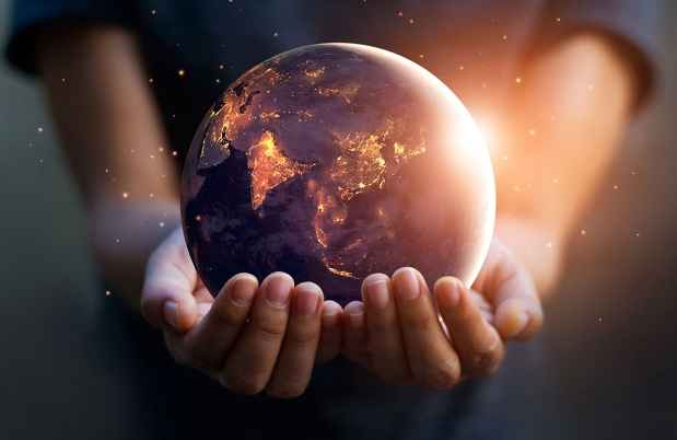 Hands hold globe
