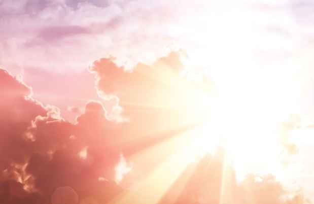 Purple cloudy sky and bold sun