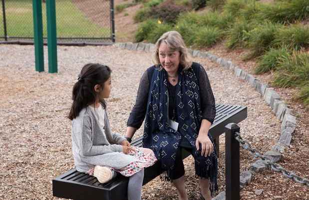 Photo of clinician and child