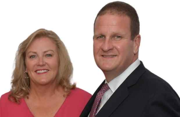 Two people smiling while posing for photo