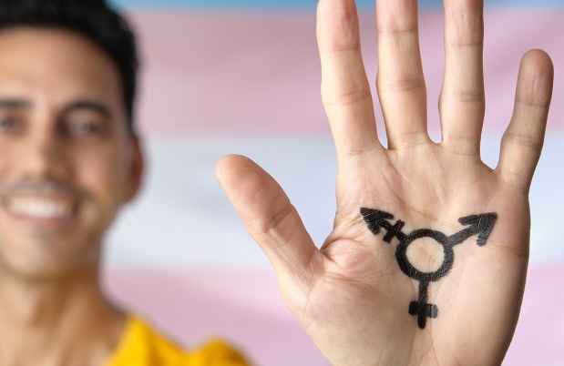 hand with intersex symbol written on it