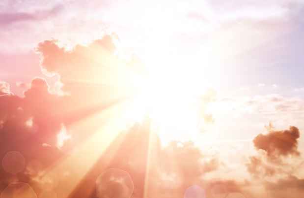 sun peaking over the clouds