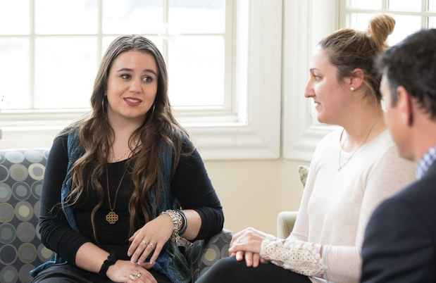 Young person talks to clinicians at McLean mental health treatment program