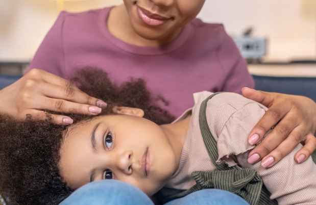 Child lying on lap