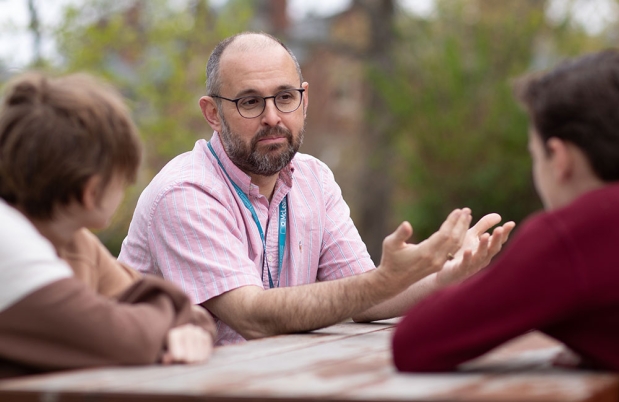 Clinician speaks with teens outside