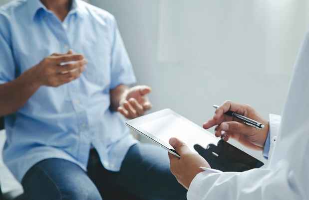 Patient talking to clinician